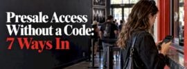 Fan checking concert presale access at a venue
